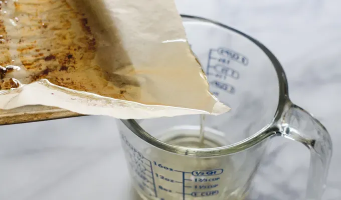 Pouring bacon grease into a measuring cup.' title='Baconnaise!