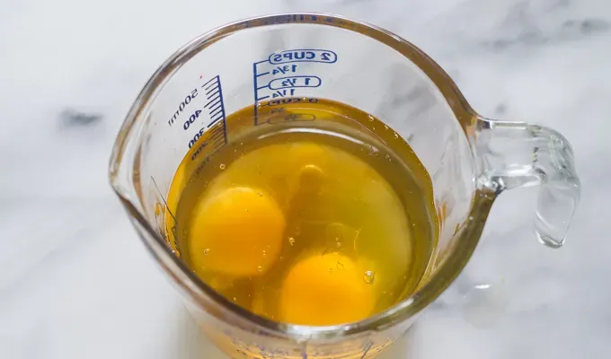 Mayonnaise ingredients in a measuring cup.' title='Baconnaise!