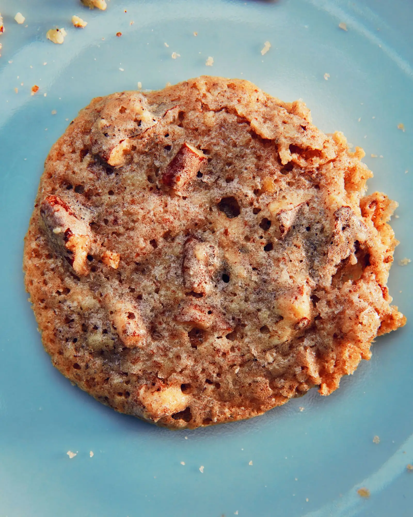 A pecan cookie on a plate.