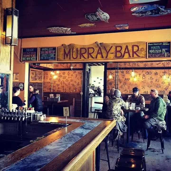 murray bar in montana. the walls have cattle-branding iconography
