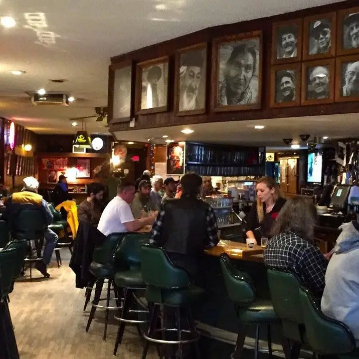 Charlie B’s in Missoula. a bunch of portraits of important locals hang over the bar