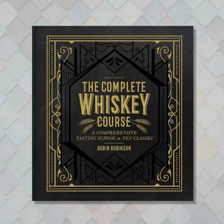 The Complete Whiskey Course cover with ornate gold text and filigree on a black background with black filigree