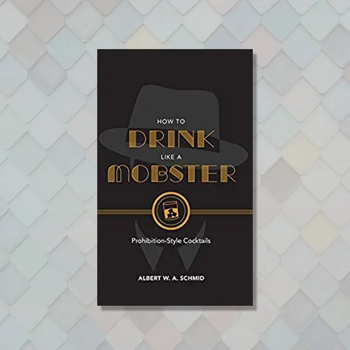How to Drink Like a Mobster cover, black with amber midcentury font and a silhouette of a man in a fedora
