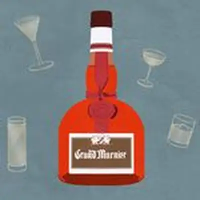 Grand Marnier bottle against faded blue background with cocktail illustrations