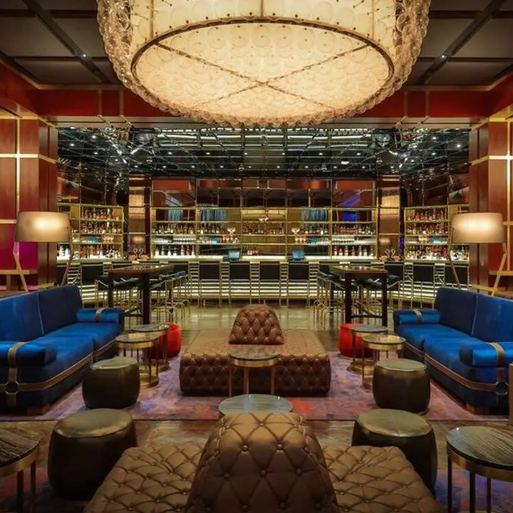 The Dorsey at the Venetian Las Vegas. Silky navy blue couches and tufted lounges abound