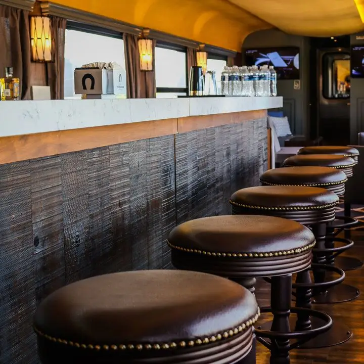 Tequila Herradura Express Train. A bar with a napkin dispenser featurin gthe Herradura horseshoe logo