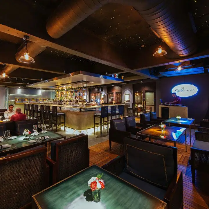 La Plume interior, with view of tables and bar.