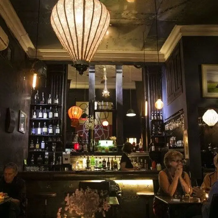 Tadioto interior, with dark wood and moody lighting