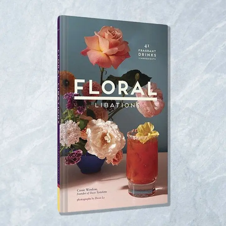 Floral Libations cover featuring a red drink garnished with a yellow flower and a bouquet of mixed flowers behind it
