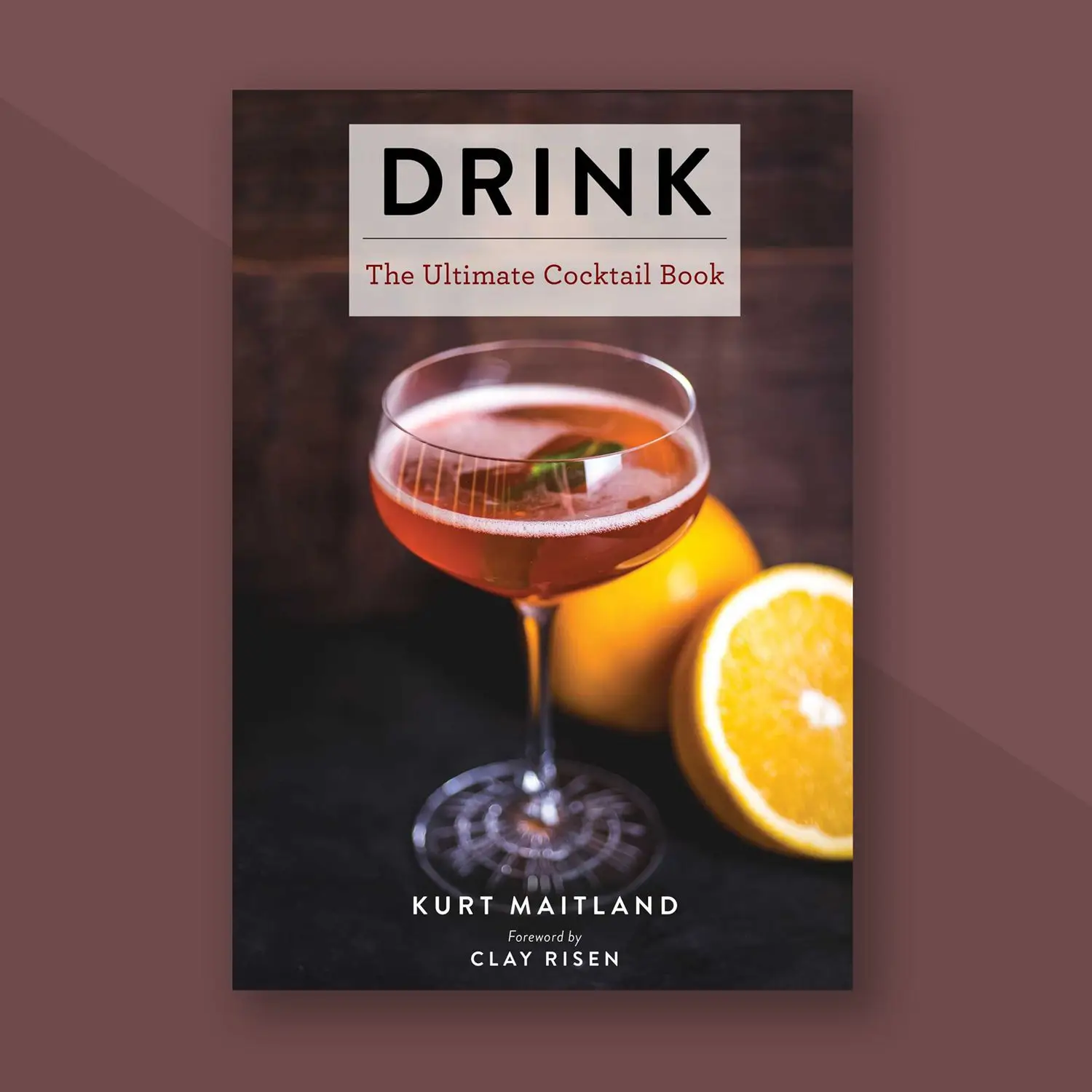 Cover of Drink: The Ultimate Cocktail Book by Kurt Maitland, on maroon background