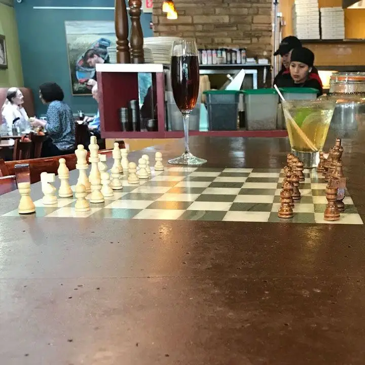The Daily Dish interior view of bar top with chess board