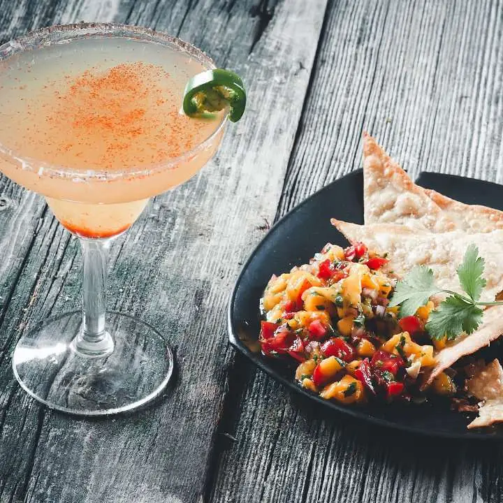 Princess Cruises shore excursion in Mazatlán, Mexico, with a plate of ceviche and a paloma-looking cocktail with a jalapeño-ring garnish