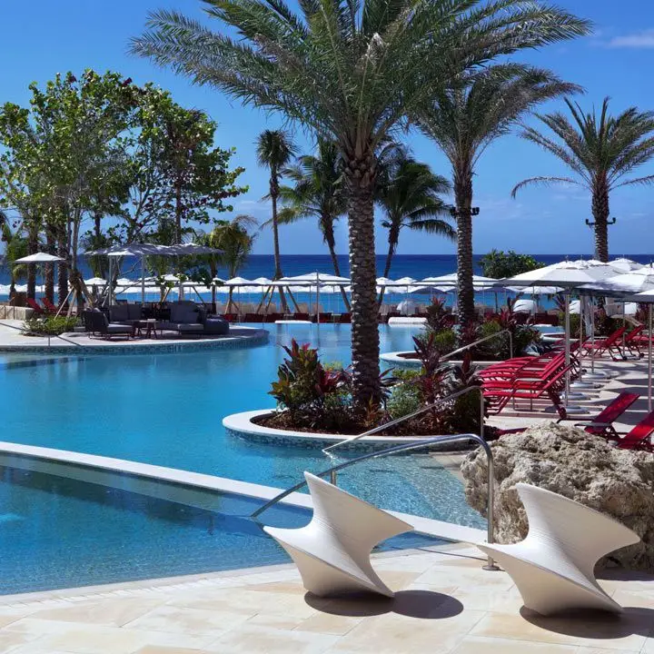 Kimpton Seafire Resort & Spa’s pool with palm trees