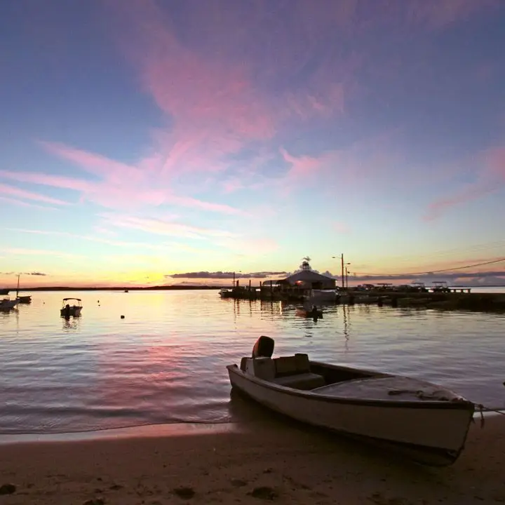 Harbour Island, Bahamas view of fishing boats on the water at sunset