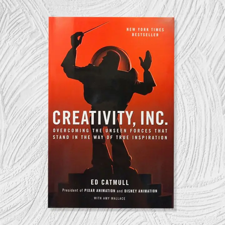 Creativity, Inc. cover with red gradient background and the shadowy silhouette of Buzz Lightyear as a music conductor. White all-caps sans serif text overlaid