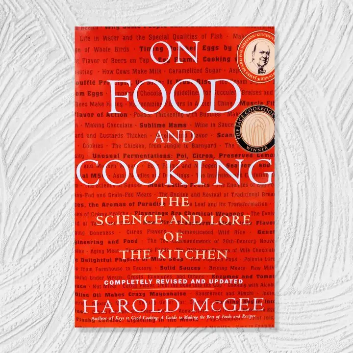 On Food and Cooking cover, bright red background with small black decorative text and white cover text overlaid