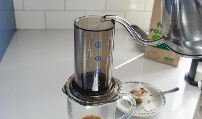 Pouring the hot water into the aeropress.' title='Dirty Chai Latte