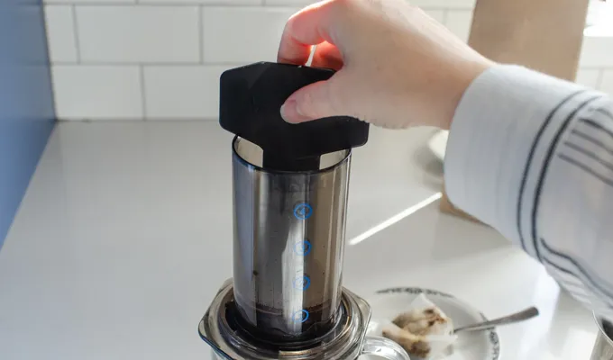 Stirring the coffee in the aeropress.' title='Dirty Chai Latte