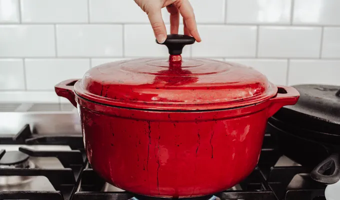 Putting the lid on the Dutch oven.' title='Chicken Feet Bone Broth Recipe