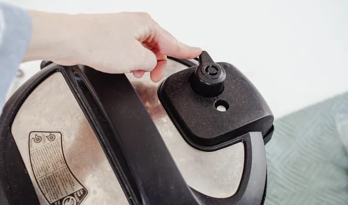 Setting the Instant Pot to sealing.' title='Chicken Feet Bone Broth Recipe