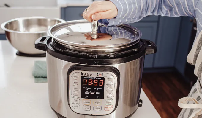 Putting a lid on the Instant Pot.' title='Chicken Feet Bone Broth Recipe