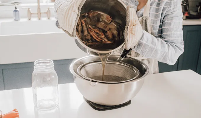 Straining the broth.' title='Chicken Feet Bone Broth Recipe