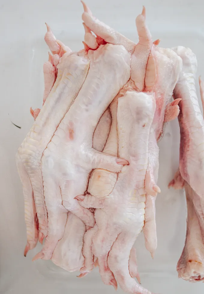 Close up shot of raw chicken feet.' title='Chicken Feet Bone Broth Recipe
