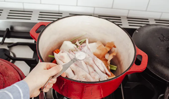 Adding the salt.' title='Chicken Feet Bone Broth Recipe