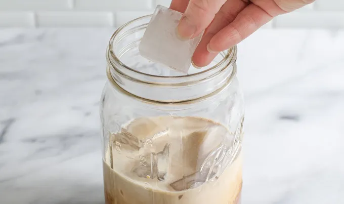 Adding ice to a mason jar.' title='Mocha Frappuccino Recipe