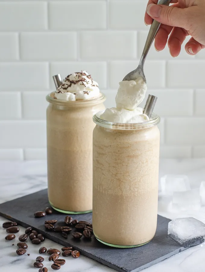 Adding a dollop of whipped cream on top.' title='Mocha Frappuccino Recipe