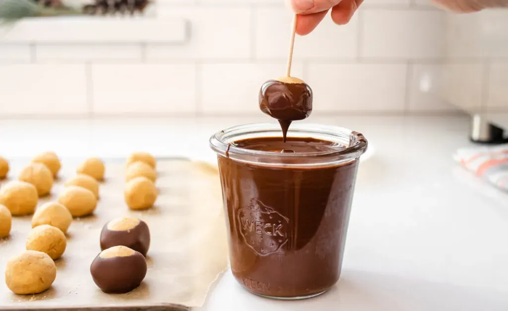 Letting the chocolate drip back into the glass. ' title='Buckeye Recipe Without Shortening