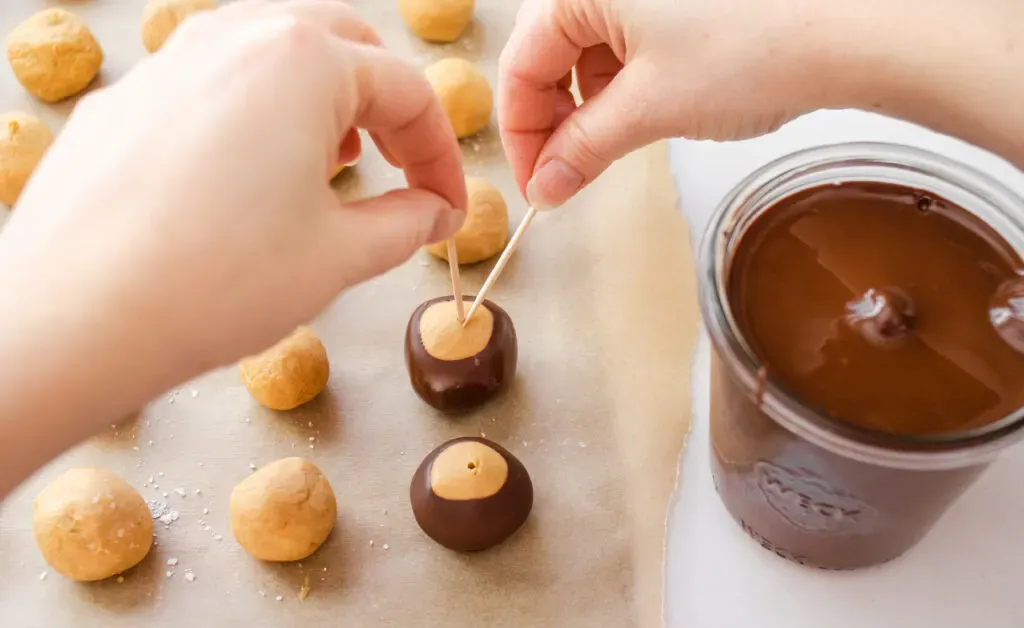 Placing the buckeyes back on the baking sheet. ' title='Buckeye Recipe Without Shortening