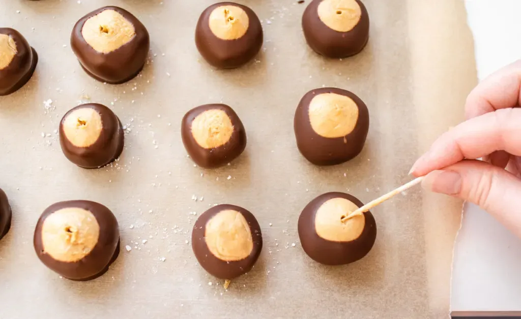 Smoothing over the holes with a toothpick.' title='Buckeye Recipe Without Shortening