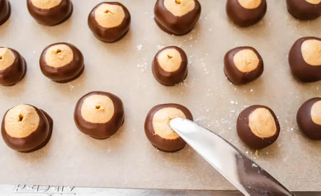 Smoothing over the holes with a knife.' title='Buckeye Recipe Without Shortening