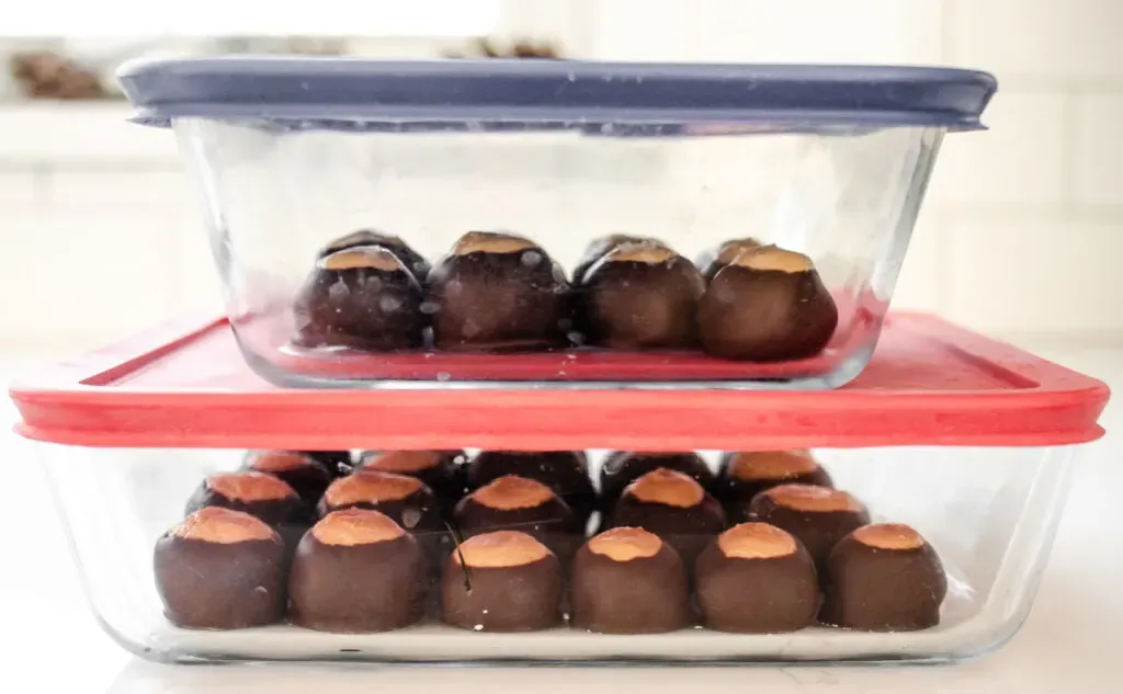 The finished buckeyes in an airtight storage container. ' title='Buckeye Recipe Without Shortening