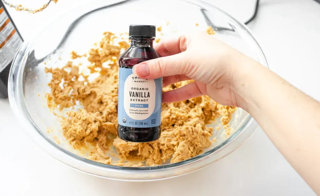 Adding the vanilla extract to the peanut butter dough.' title='Buckeye Recipe Without Shortening