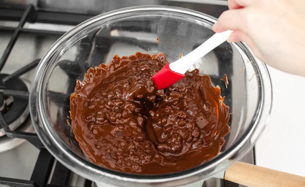 Melting the chocolate in a double boiler. ' title='Buckeye Recipe Without Shortening