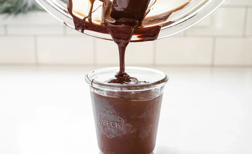 Pouring the chocolate into a glass for dipping the buckeyes. ' title='Buckeye Recipe Without Shortening