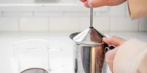 Frothing the chocolate/milk mixture using a hand pump frother. ' title='Peppermint Mocha Starbucks Recipe