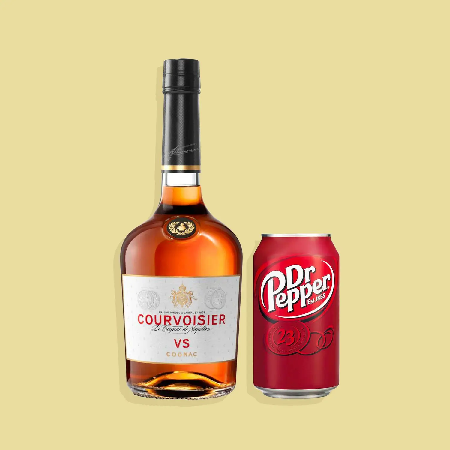 Bottle of Courvoisier VS cognac and can of Dr Pepper against yellow background