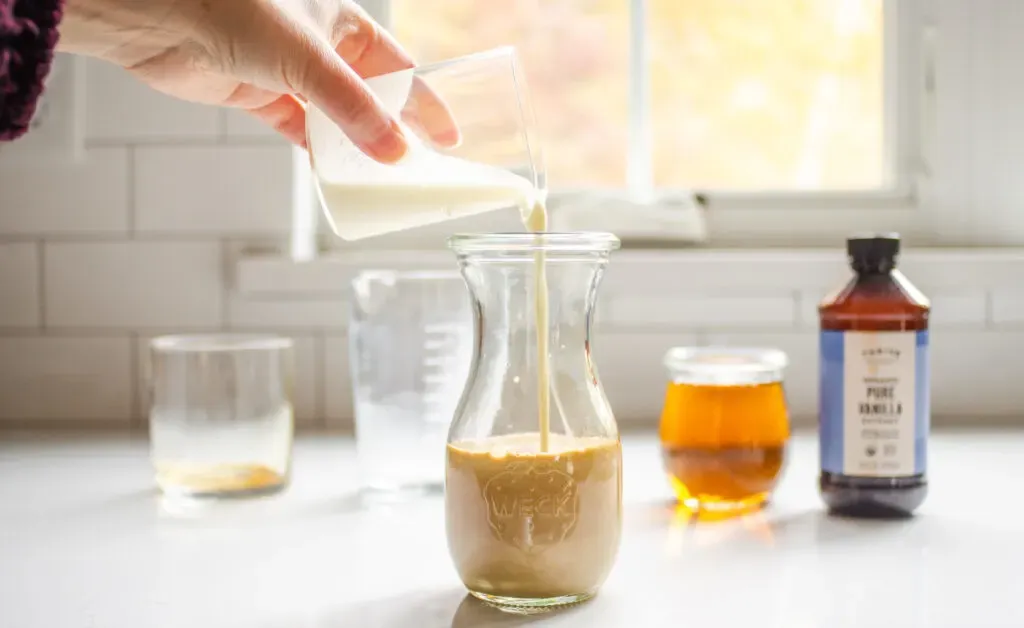Pouring the cream into the jar to make the bottled frappuccino. ' title='Starbucks Bottled Frappuccino Recipe