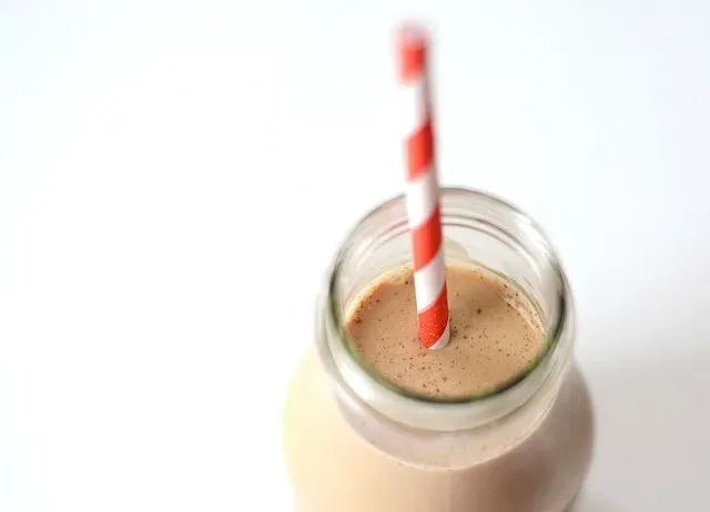 A jar of homemade Starbucks bottled Frappuccino on a white counter with white subway tile backsplash in the background. ' title='Starbucks Bottled Frappuccino Recipe