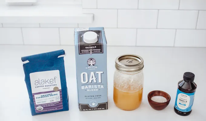 All of the ingredients needed to make an oat milk latte.' title='Oat Milk Latte