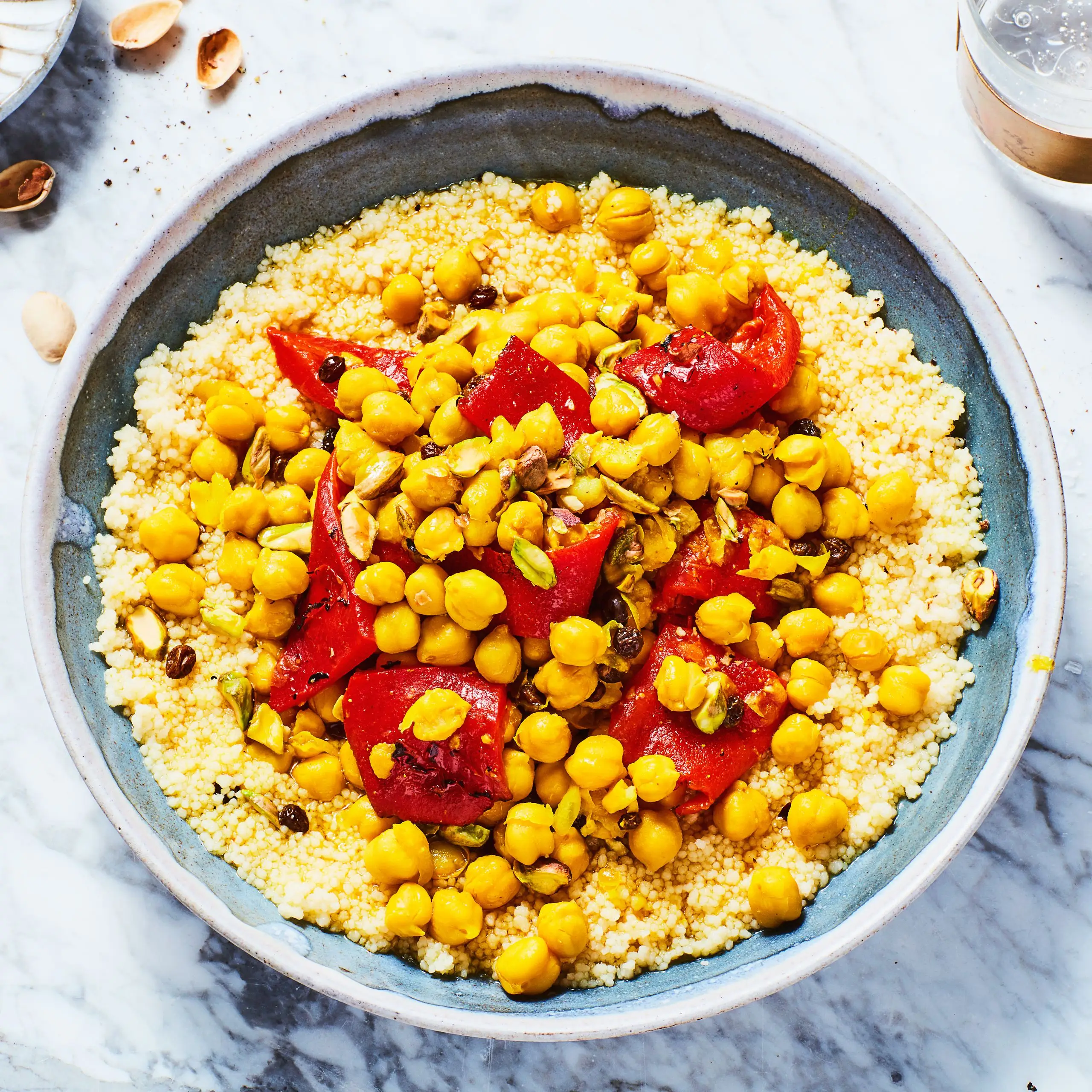 One of our favorite pantry recipes chickpea and roasted red pepper tagine in a bowl with couscous.