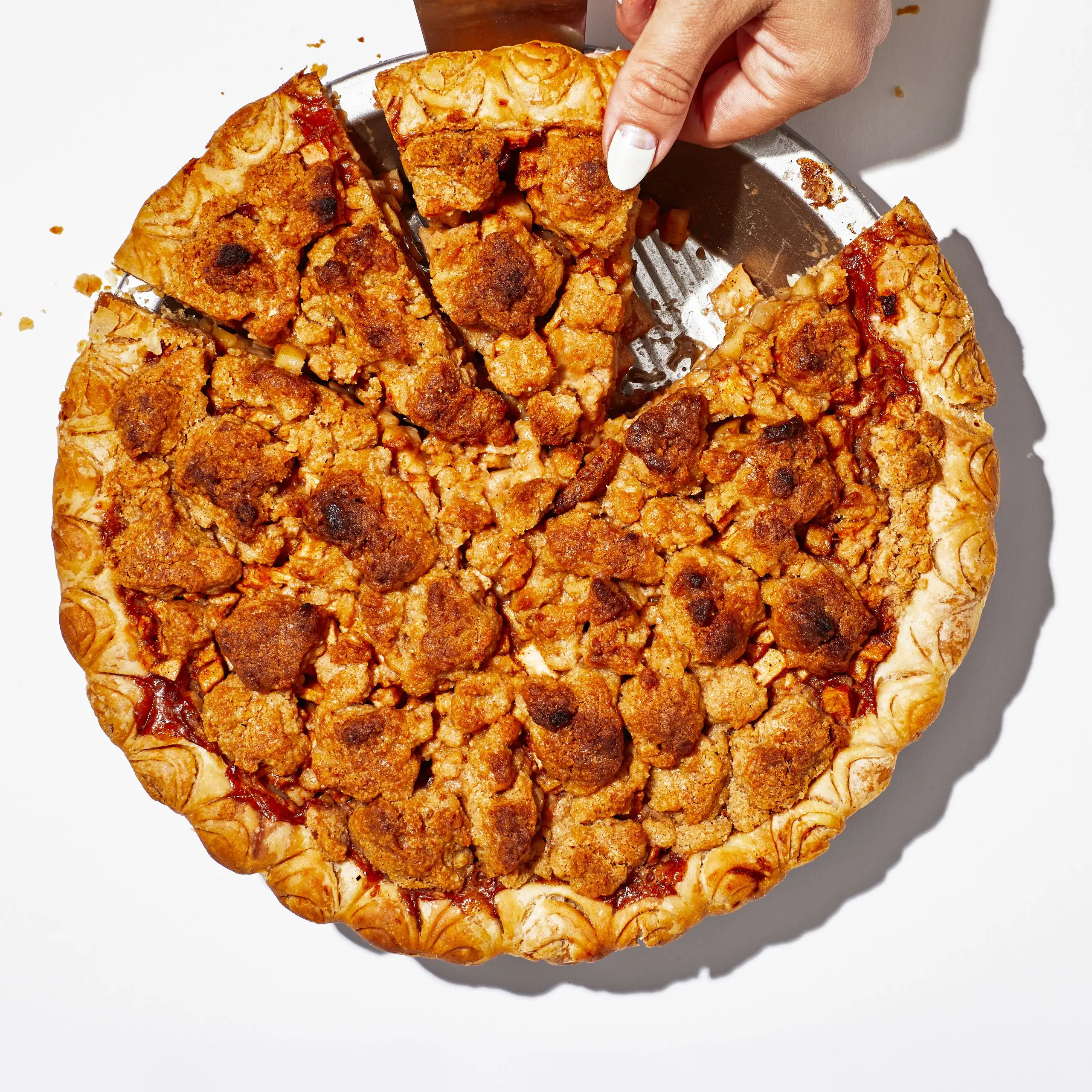 Brown apple pie isolated on white.