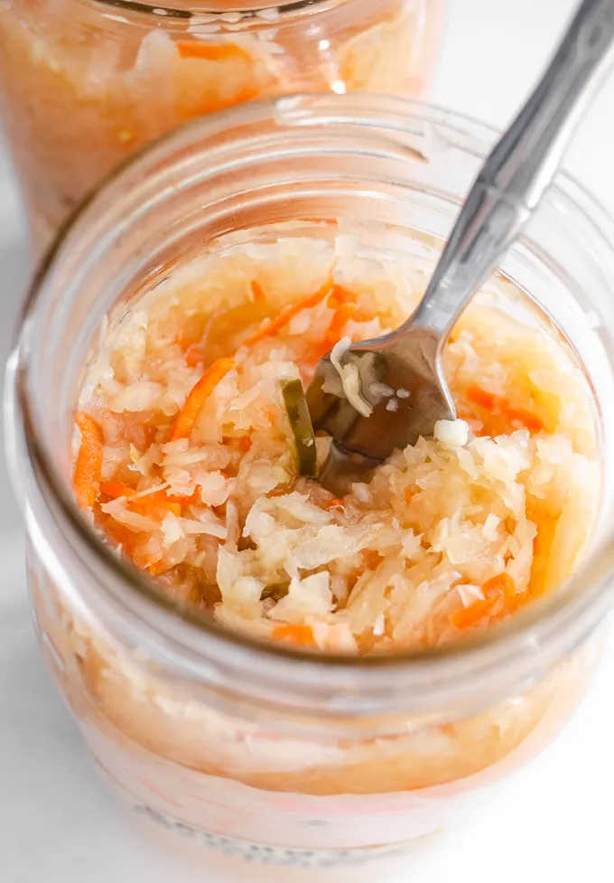 A jar of spicy sauerkraut made with jalapenos.' title='Easy Spicy Sauerkraut Recipe