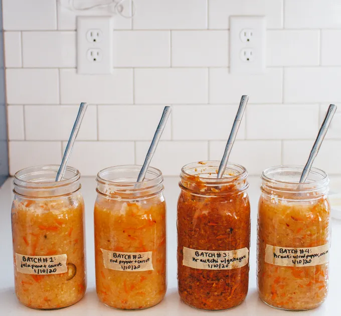 4 jars of spicy sauerkraut on a kitchencounter.' title='Easy Spicy Sauerkraut Recipe
