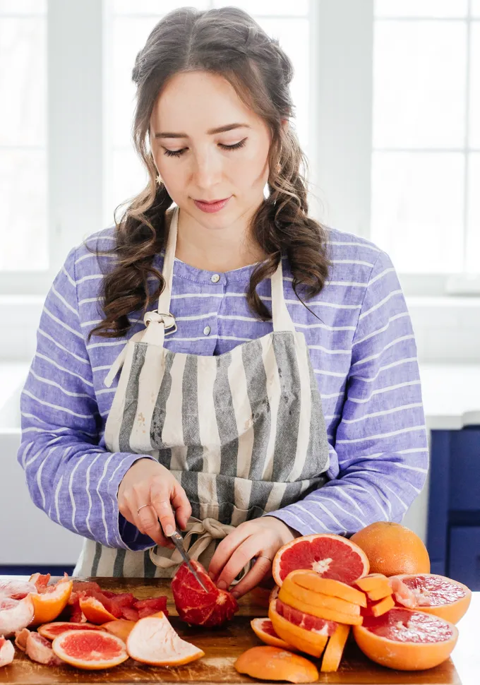 Slicing a grapefruit the best way.' title='How to Cut a Grapefruit