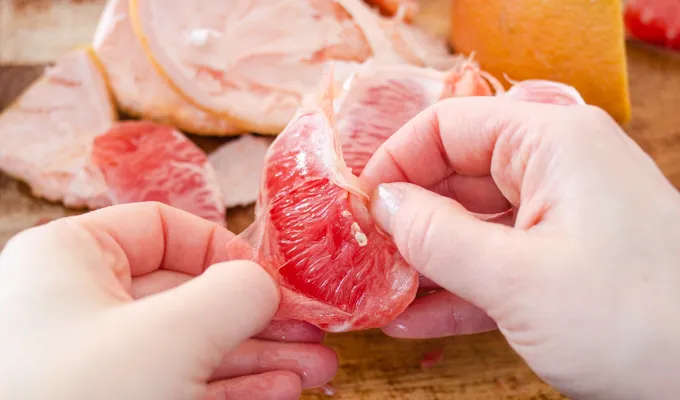 How to remove the membranes from grapefruit slices.' title='How to Cut a Grapefruit