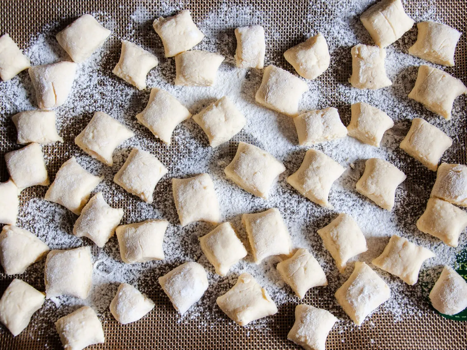 Image may contain Food Pasta Ravioli Confectionery Sweets and Rug